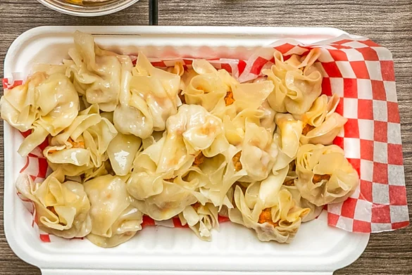 Steamed pork siomai on checkered paper